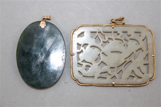 Two Chinese jade plaques, 5.3cm., the mount marked 18K